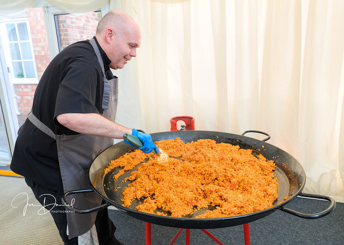 resized and optimsed image of Ian the Chef with paella