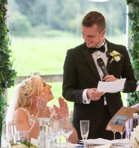 Groom making a speech to his wife at Hilltop Country House.