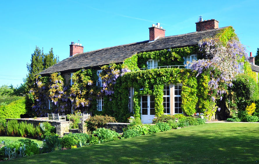The exterior of Hilltop Country House in summer.