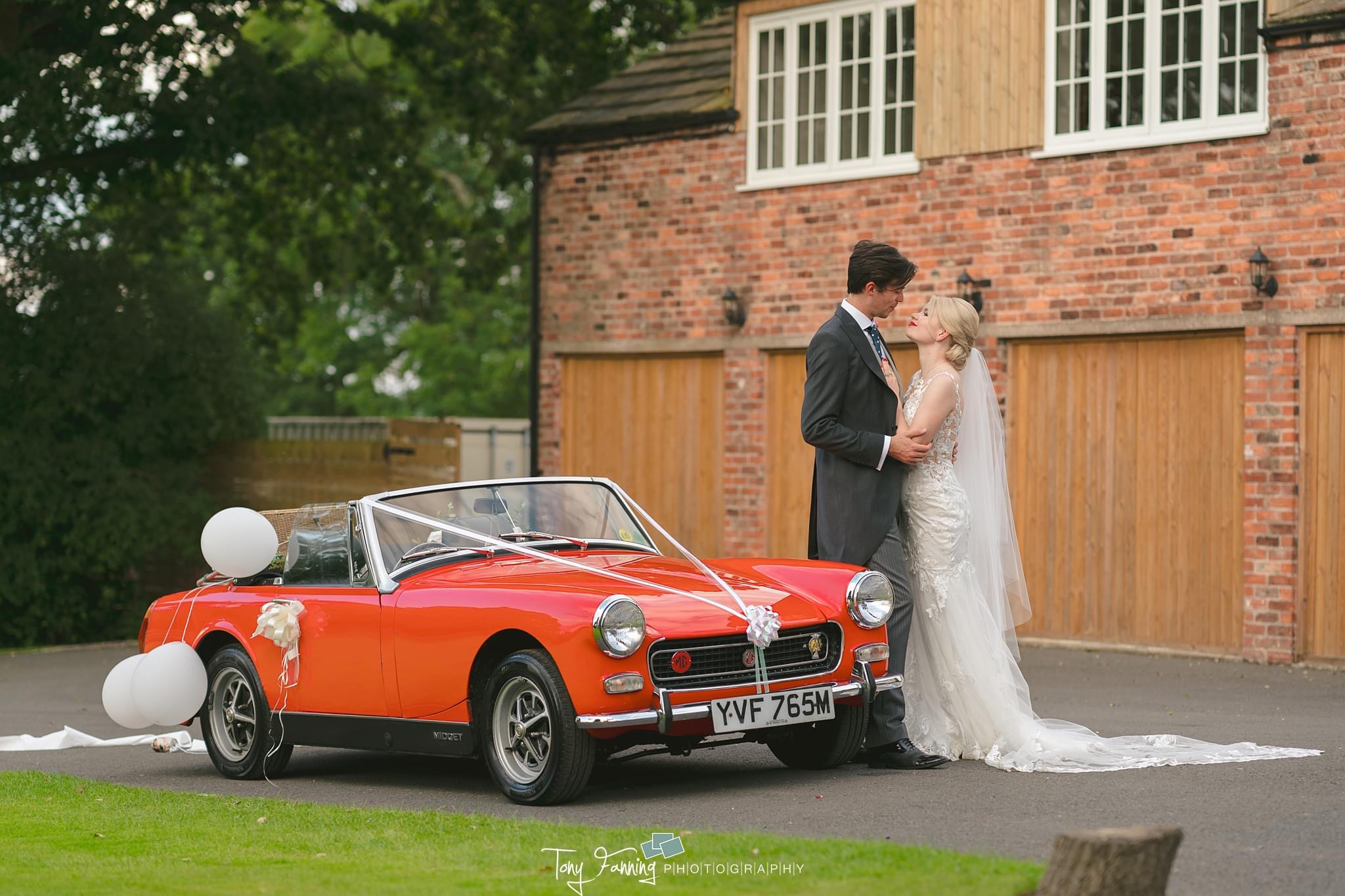 Lydia and Matt travelled from the church to their reception at Hilltop Country House in a red sportscar